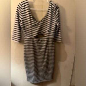 New never worn, black and white striped dress with cut outs